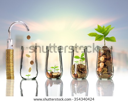 Faucet putting Gold coins and seed in clear bottle on cityscape photo blurred cityscape background,Business investment growth concept