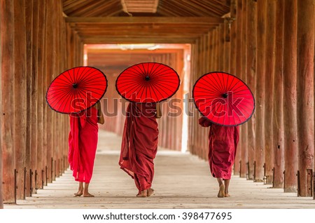Back side of three Buddhist novice are walking in pagoda,myanmar