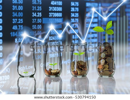 Gold coins and seed in clear bottle on Stock market exchange data on LED display background, Business investment growth and trading concept