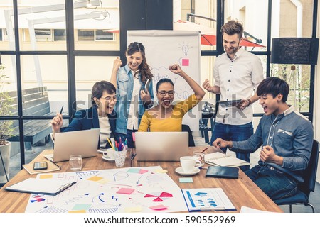 Group Of Asian and Multiethnic Business people with casual suit working with happy action and celebrate in the modern Office, people business group concept