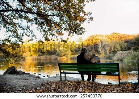 Happy loving couple next to a lake