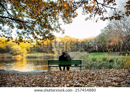 Happy loving couple next to a lake