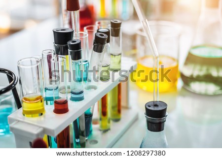 Test tube containing chemical liquid in laboratory, lab chemical research and development concept