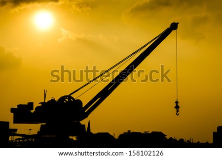 silhouette of stationary harbor crane
