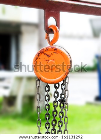 Orange metal hoist