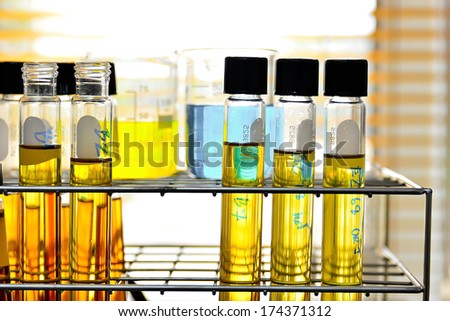 Laboratory glassware with blue and yellow liquid