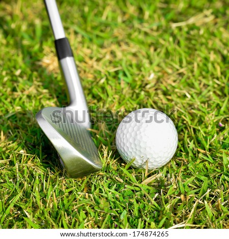 Golf Ball And Golf Club On Green Glass