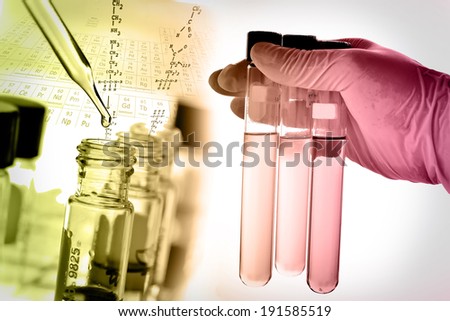 Laboratory research, test tube in scientist hand and dropping fluid to test tube