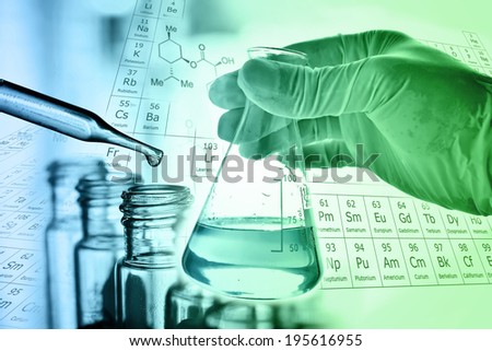 Flask in scientist hand with test tube