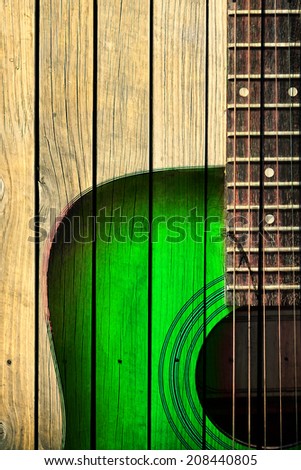 Acoustic guitar art on wooden wall
