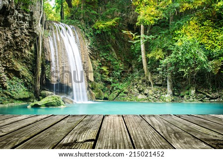Beautiful waterfall with wooden floor platform