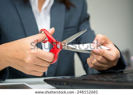 Business woman cutting unusable name card