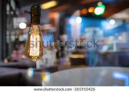 Retro style lighting decor with blur coffee shop background