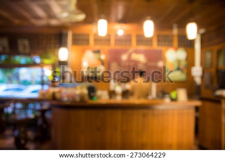 abstract blurred coffee shop with bokeh light, warm light tone
