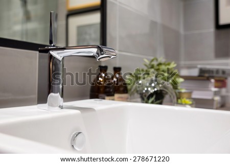 Modern faucet and wash basin in luxury bathroom