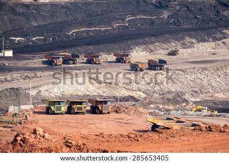 Part of a coal mine pit with big mining truck working
