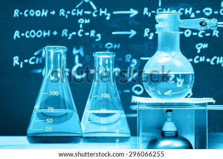 Conical flask and boiling chemical in round bottom flask, laboratory concept