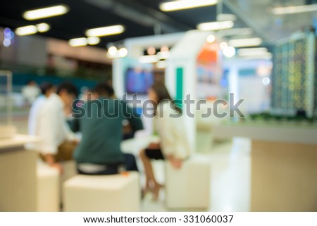 abstract blurred people meeting at house exhibition trade show