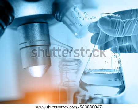 microscope with hand of scientist holding flask, science laboratory research and development concept