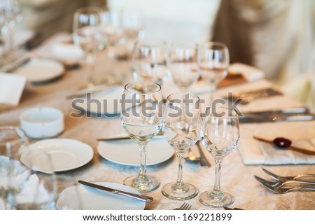 Table set for an classy event - close up on the three glasses in-line