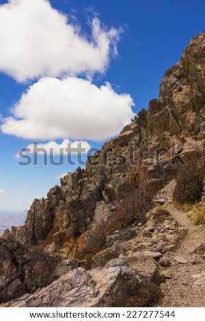 The view of a path going up on a steep mountain.