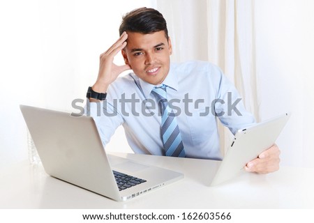 Young Successful Man working at the office with Computer