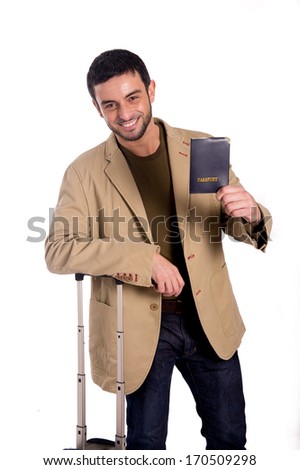 vertical half length portrait of a smiling man holding a passport in casual clothes on a white background