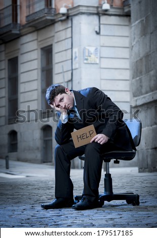 frustrated Business Man sitting on Office Chair on Street in stress