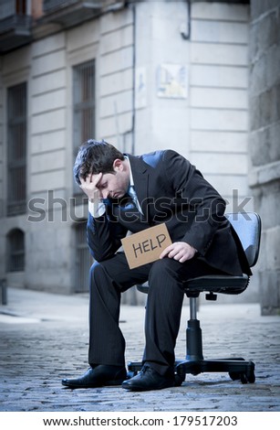 frustrated Business Man sitting on Office Chair on Street crying in stress
