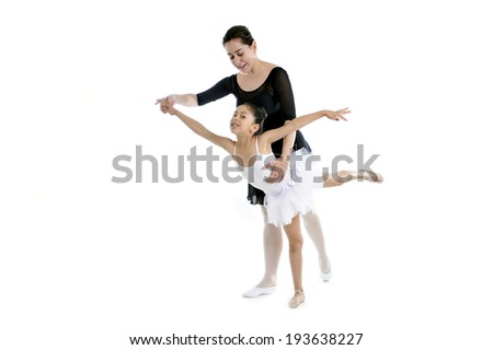 young little girl ballerina learning dance lesson with female ballet teacher