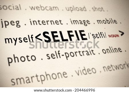 Selfie worldwide used new word written dictionary page among related concepts like internet, image, photo and video