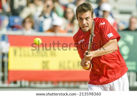 Spanish tennis player Marcel Granollers returns a ball during the Davis Cup 1/4 Final at Oropesa del Mar in Spain on April 07,2012
