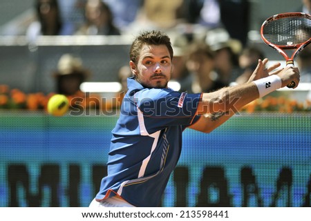 Swiss tennis player Stanislas Wawrinka returns a ball during Mutua Madrid Open 2013 clay court ATP World Tour Masters 1000 tournament in Madrid, Spain at La Caja Magica Venue on May 12,2013