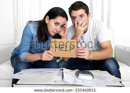 young couple worried need help in stress at home couch accounting debt bills bank papers expenses and payments feeling desperate in bad financial situation