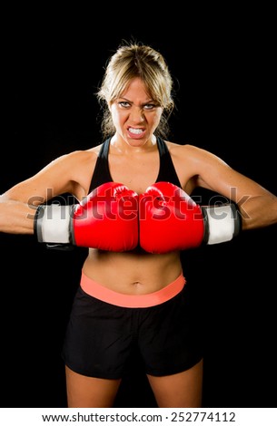 aggressive sexy boxing fighter girl with red gloves in angry face expression and sport fitness and female boxer concept isolated on back background