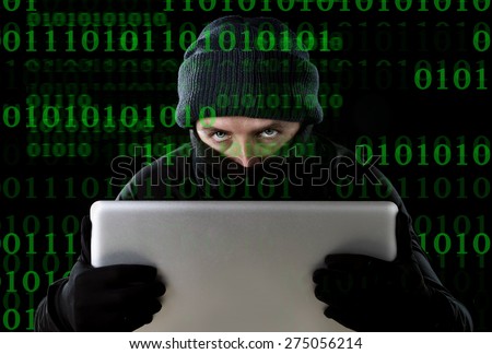 hacker man in black using computer laptop for criminal activity hacking password and private information cracking password too access bank account data in cyber crime concept