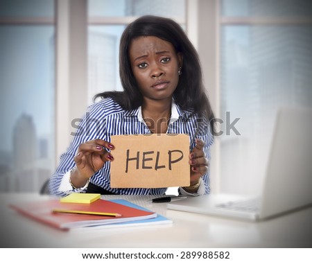 black African American ethnicity tired and frustrated woman working as secretary in stress at work business district office desk with computer laptop asking for help in frustration concept