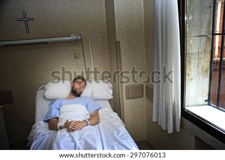 young injured patient man lying in bed hospital room resting from pain looking in bad health condition after suffering accident in health care concept