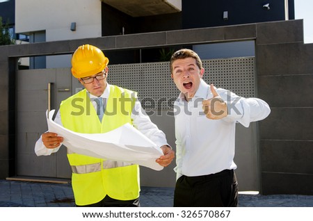 happy customer smiling giving thumb up and constructor foreman worker with helmet and vest talking outdoors on new house building blueprints in real state business and housing industry concept