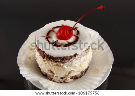 sweet cake with fruits on black background
