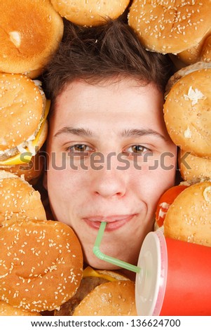 man eating hamburger