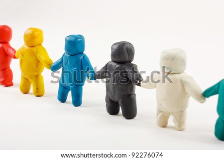 plasticine little men stand in a row
