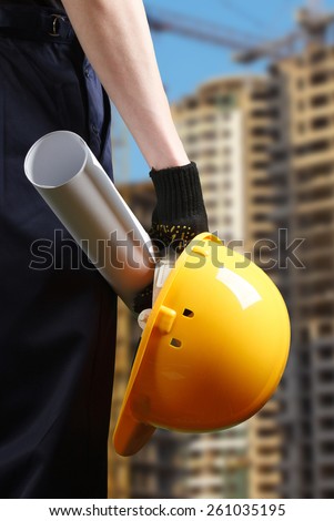 construction hard hat in hand