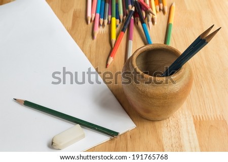 Pencils, color pencils and paper