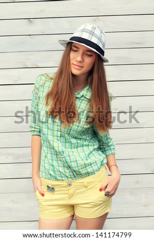 Summer urban fashion. Beautiful young girl