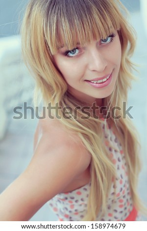 blonde girl with long hair and bangs