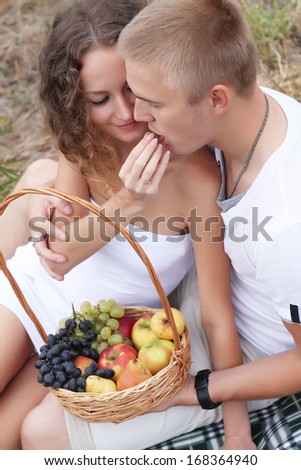 outdoor fashion portrait of young sensual couple. love and kiss