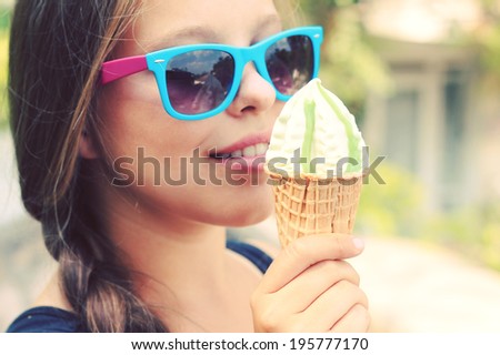 chubby girl eating pistachio ice cream. Photo toned style Instagram filters