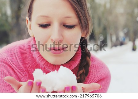 Young beautiful woman in winter clothes. Portrait outdoors
