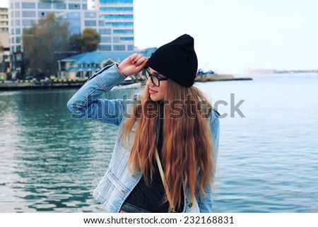 Happy traveler young woman. Attractive fashionable stylish hipster girl in spring outdoor.